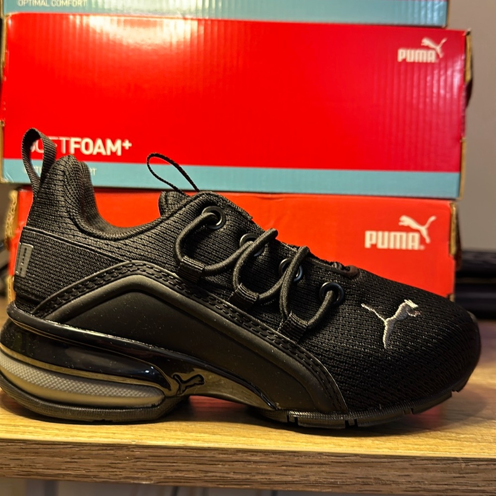 Brand new kids Puma sneaks still in the box.